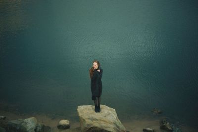 lady standing on a rock