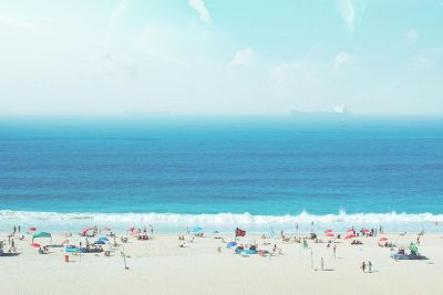 beach full of people and clear skies