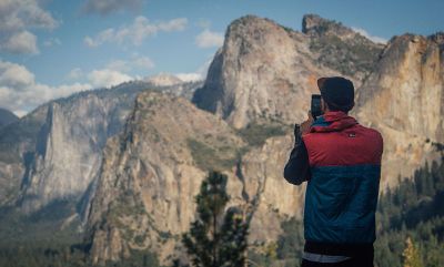 man photographing mountains