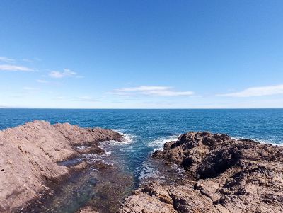 ocean with blue sky and rocks