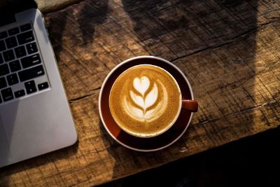 fancy coffee and laptop on the table