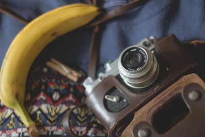 banana beside a vintage camera