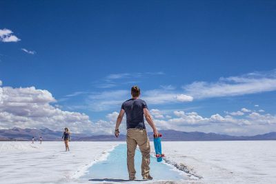 man with blue skateboard