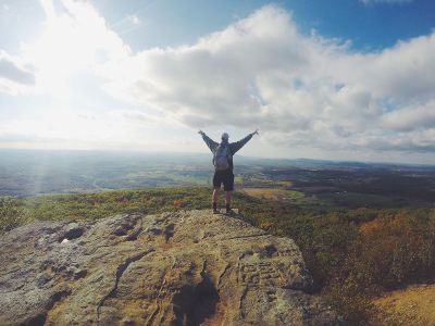 hiker on edge of cliff