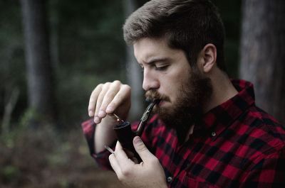 bearded man smoking pipe