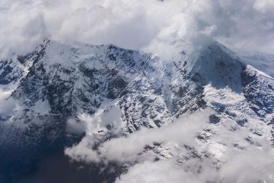 snowy mountain in the clouds