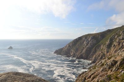 a rugged coastline with waves