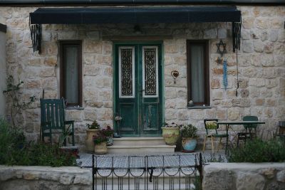 small home with green doors