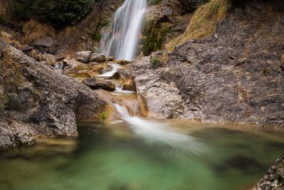 waterfall flowing into spring