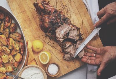 slicing meat on a cutting board