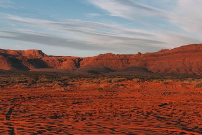 red land mountains under grey skies