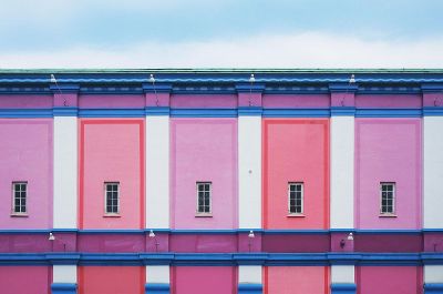 colorful pink building with windows