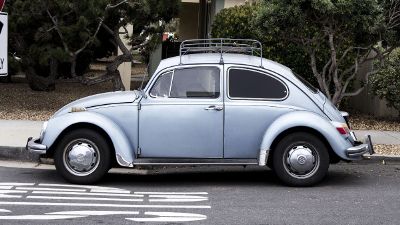 classic vw beetle parked on street