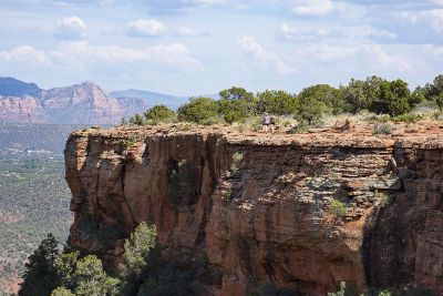 people walking on mountain edge