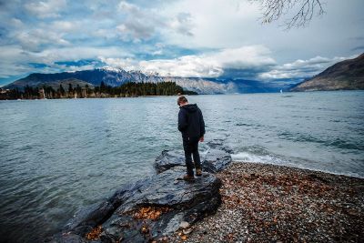 man standing by water