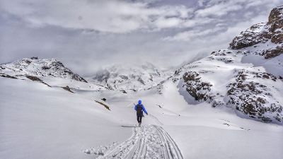 hiker in snowy mountains