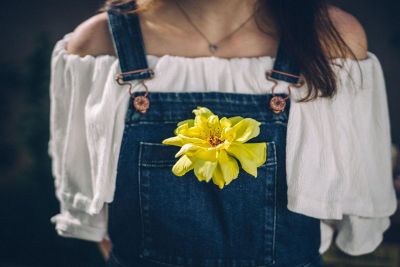 girl with flower in pocket