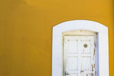 white door with yellow wall
