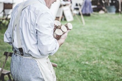 old man holding log