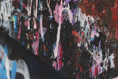 paint splattered on a black wall