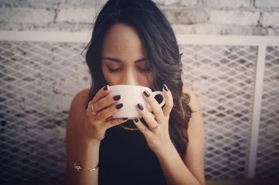 woman drinking from mug