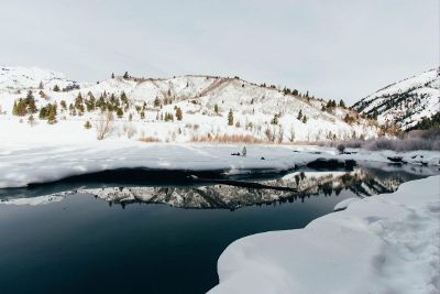 river running through snowy landscape