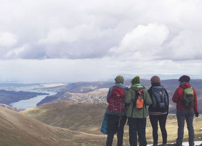 people looking at the mountains