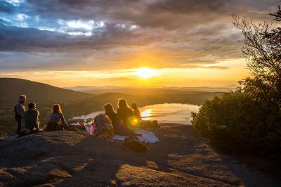 hikers watching a sunrise