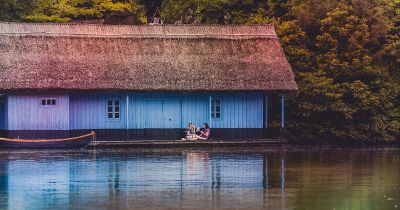 two women on porch of houseboat