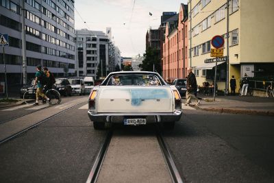 car waiting for person to pass