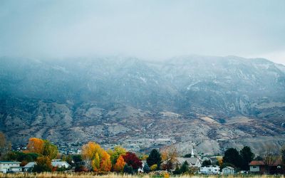 autumn village in front of mountains