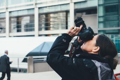 women taking picture of sky