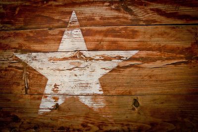 fading painted star on wood