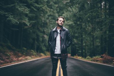 man standing in road alone