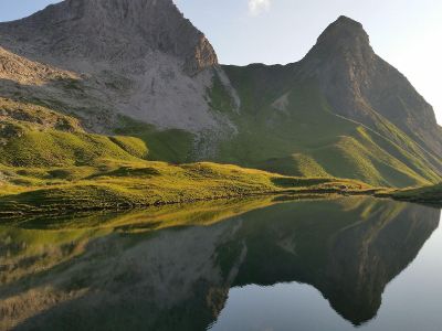 hill side by a lake