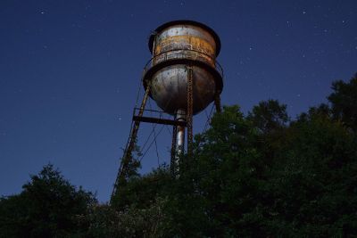 water tower in the night sky