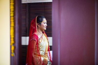 an indian bride in red dress