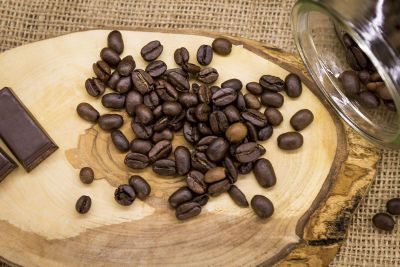 coffee beans spread on wood surface