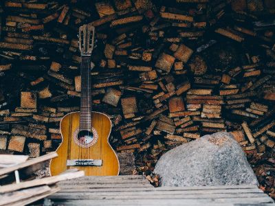 guitar resting against blocks of wood
