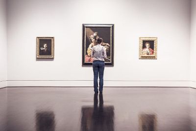 woman looking at painting