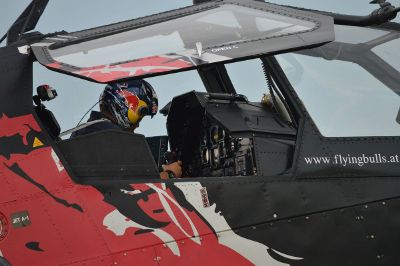 pilot in cockpit with window open