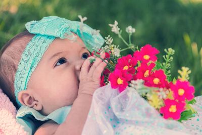 baby girl with flowers