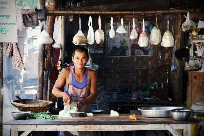 asian cook chopping vegetables