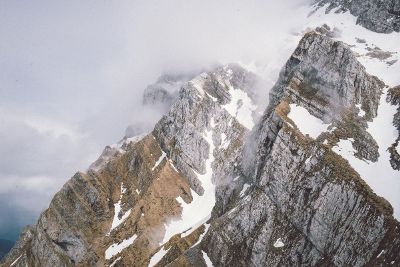 large foggy mountains with snow