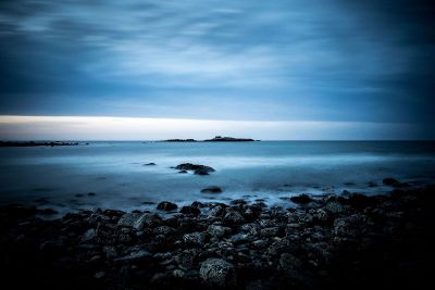 rocky beach under a cloudy sky