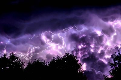 big summer storm with purple lightning