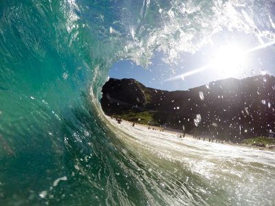 powerful ocean waves covering swimmers