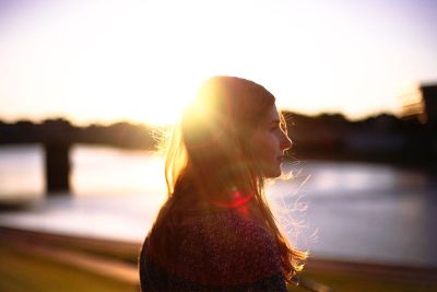 sun creates halo on beautiful girl