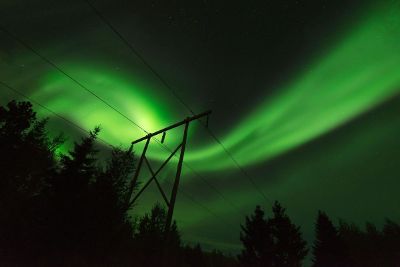 aurora borealis over power lines