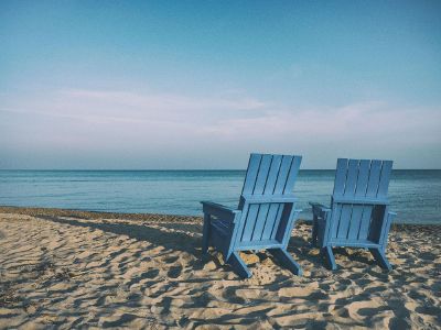 wooden chairs on the beach